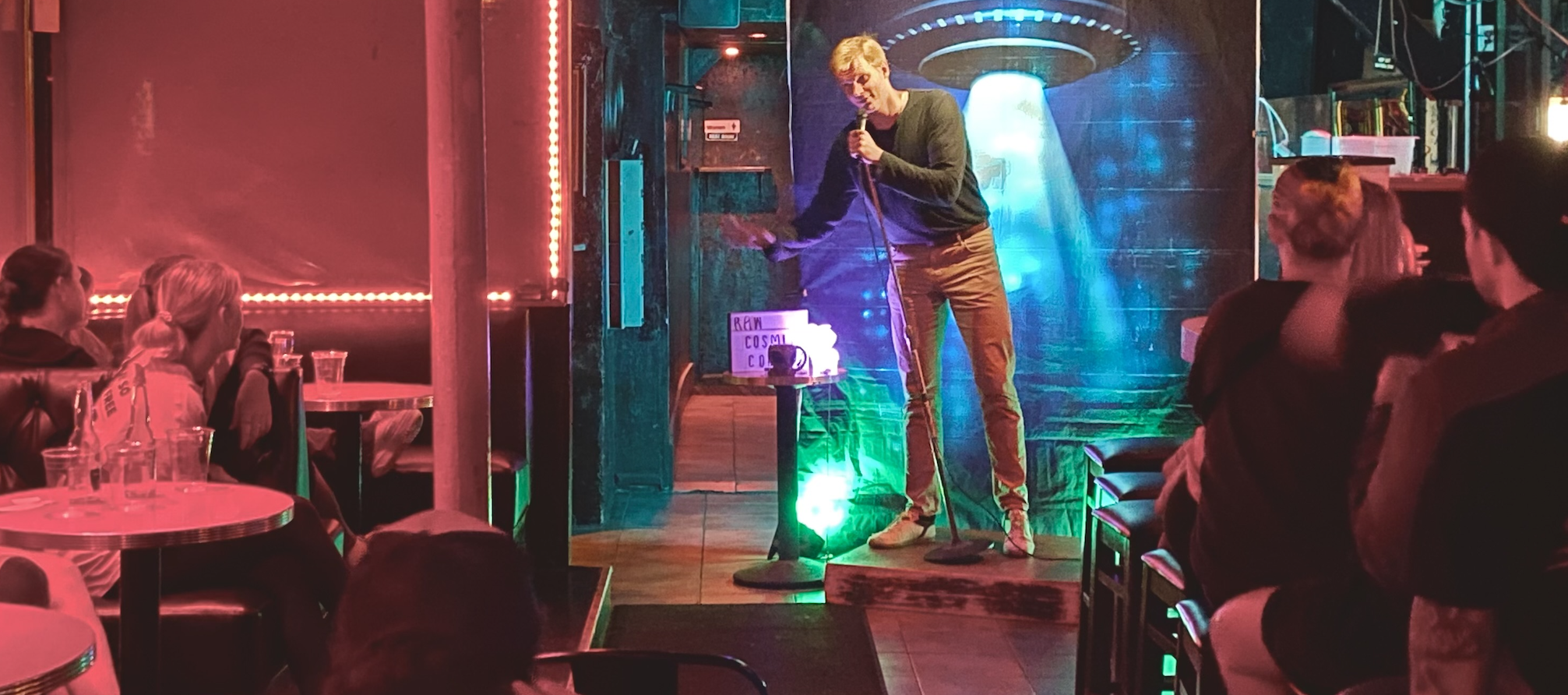 Crowd and stage lights at Cosmic Comedy